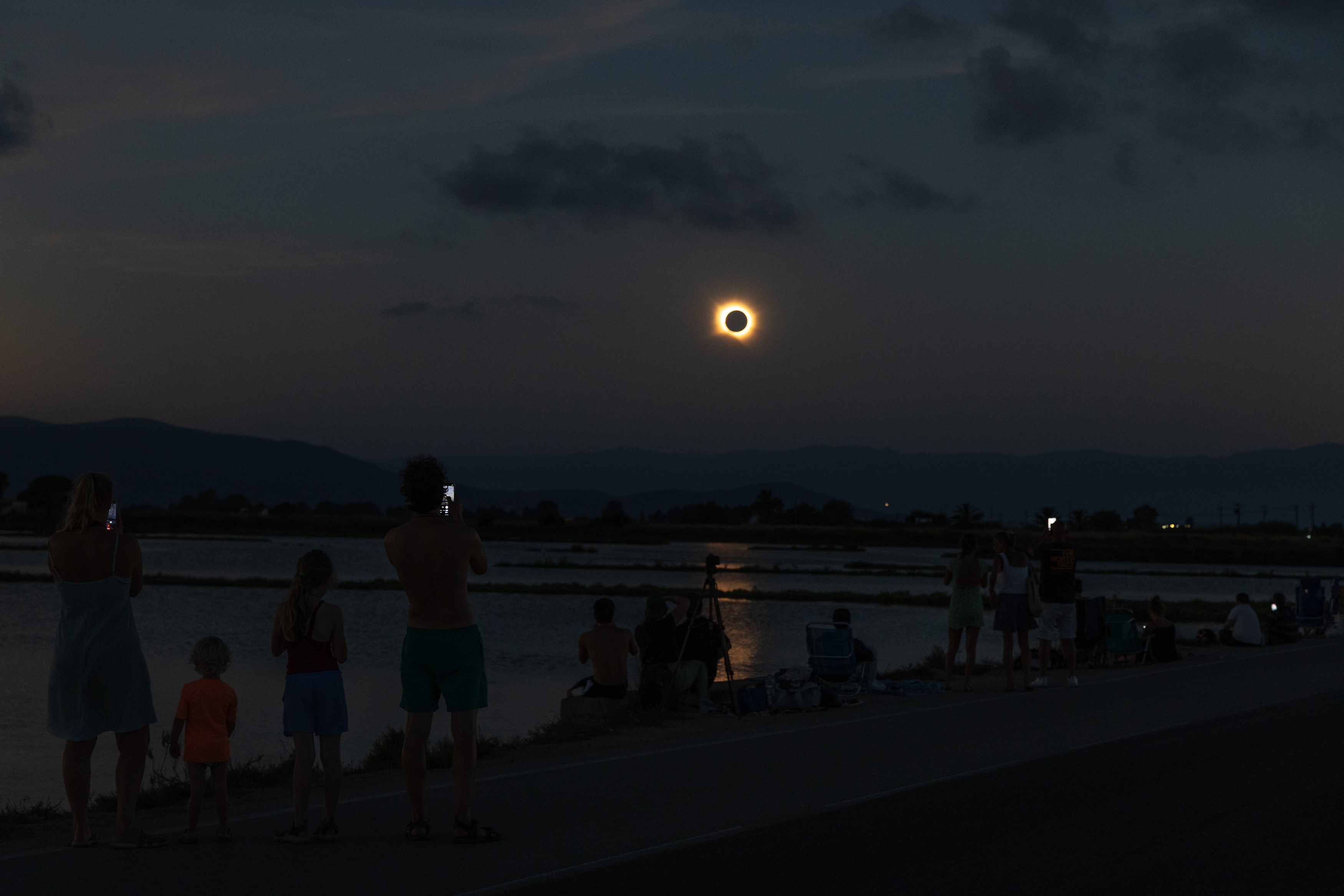 AMPOSTA, SPAIN - AUGUST 12: People gather to view a total solar eclipse on August 12, 2026 in the Ebro Delta near Amposta, Spain. It was the first time a total solar eclipse, when the sun is blocked by the moon's orbit, could be viewed from Spain since 1905. (Photo by James Breeden/Getty Images)