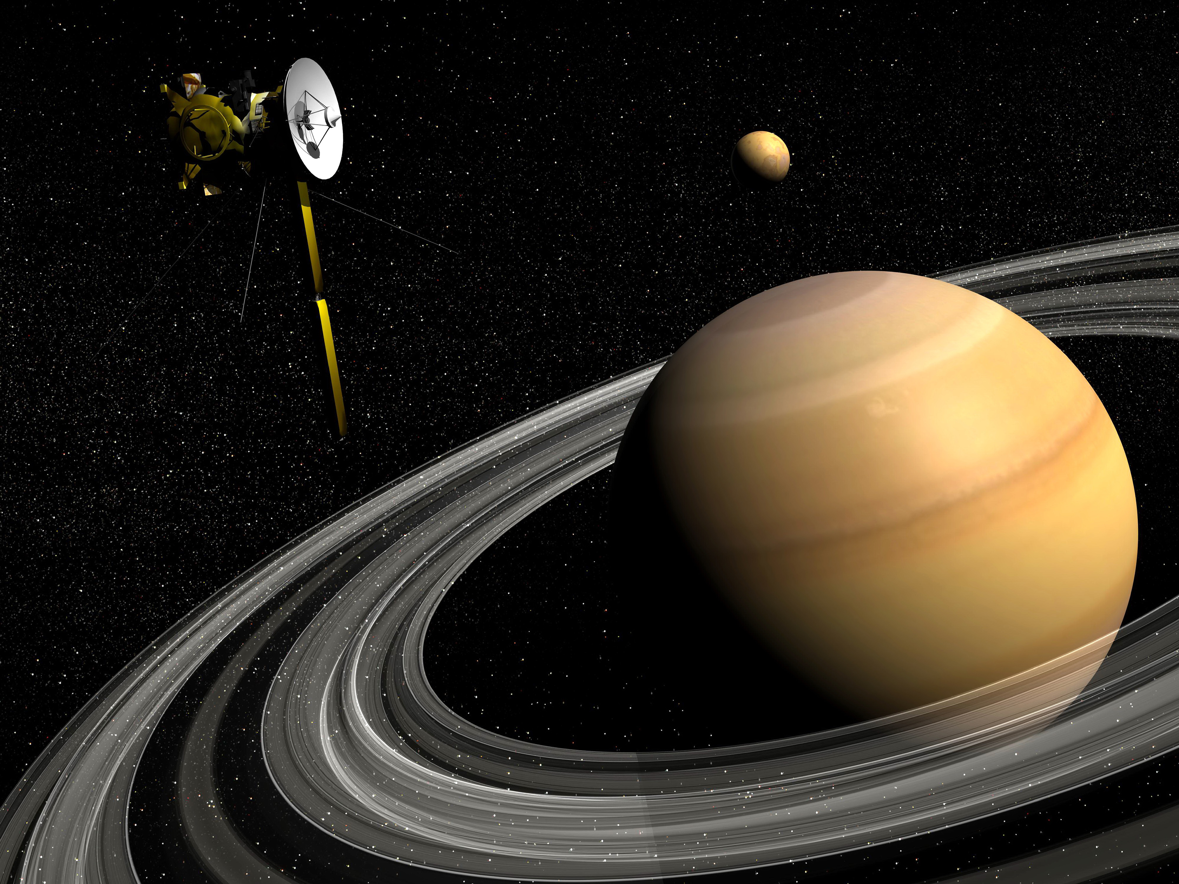Cassini spacecraft orbiting Saturn and and its moon Titan.