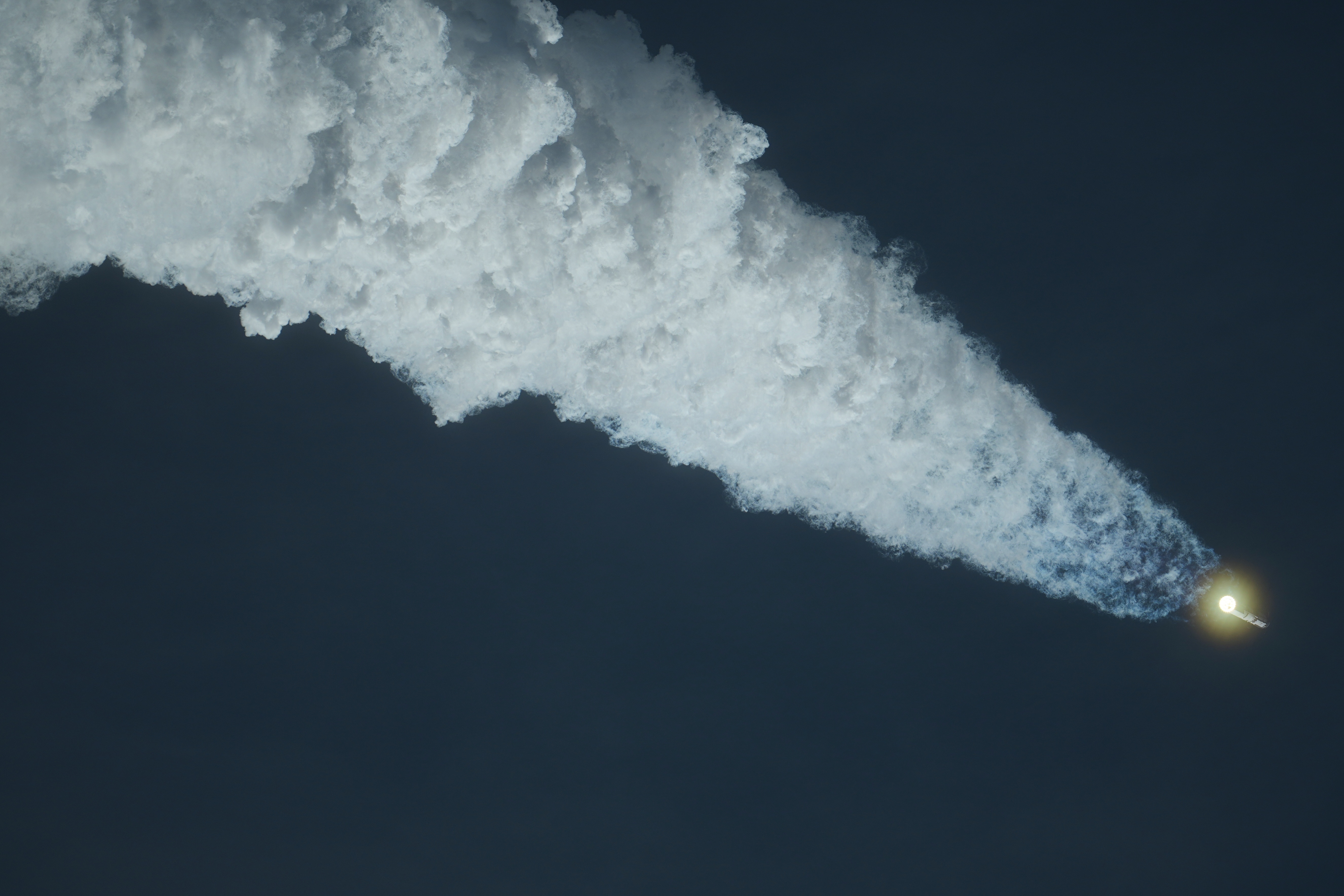 SpaceX's Starship leaves behind a plume as it rises towards space. (Image Source: AP Photo | Eric Gay)