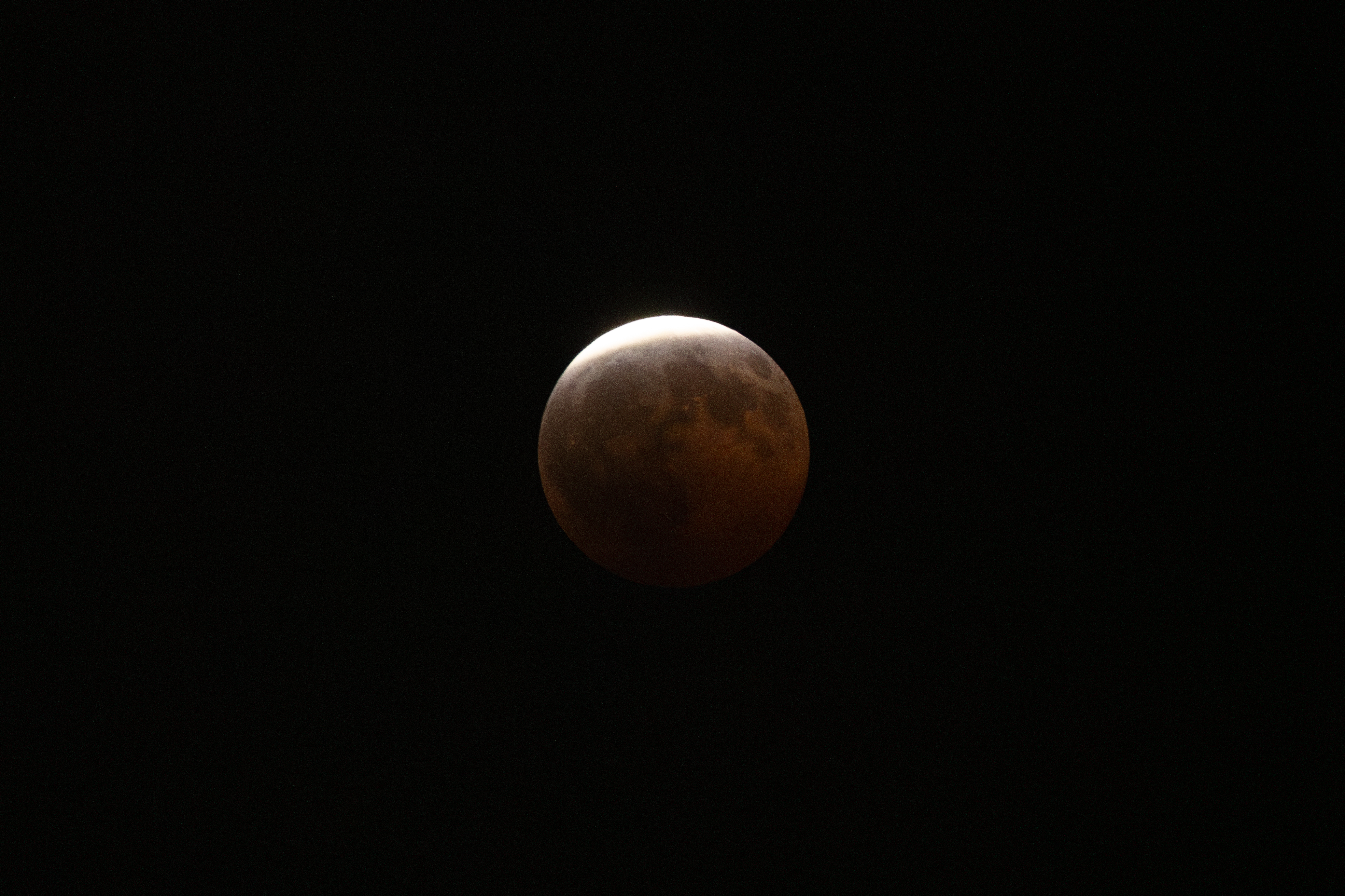 A partial lunar eclipse is seen in Los Angeles, Thursday, Aug. 27, 2026. (AP Photo/Jae C. Hong)