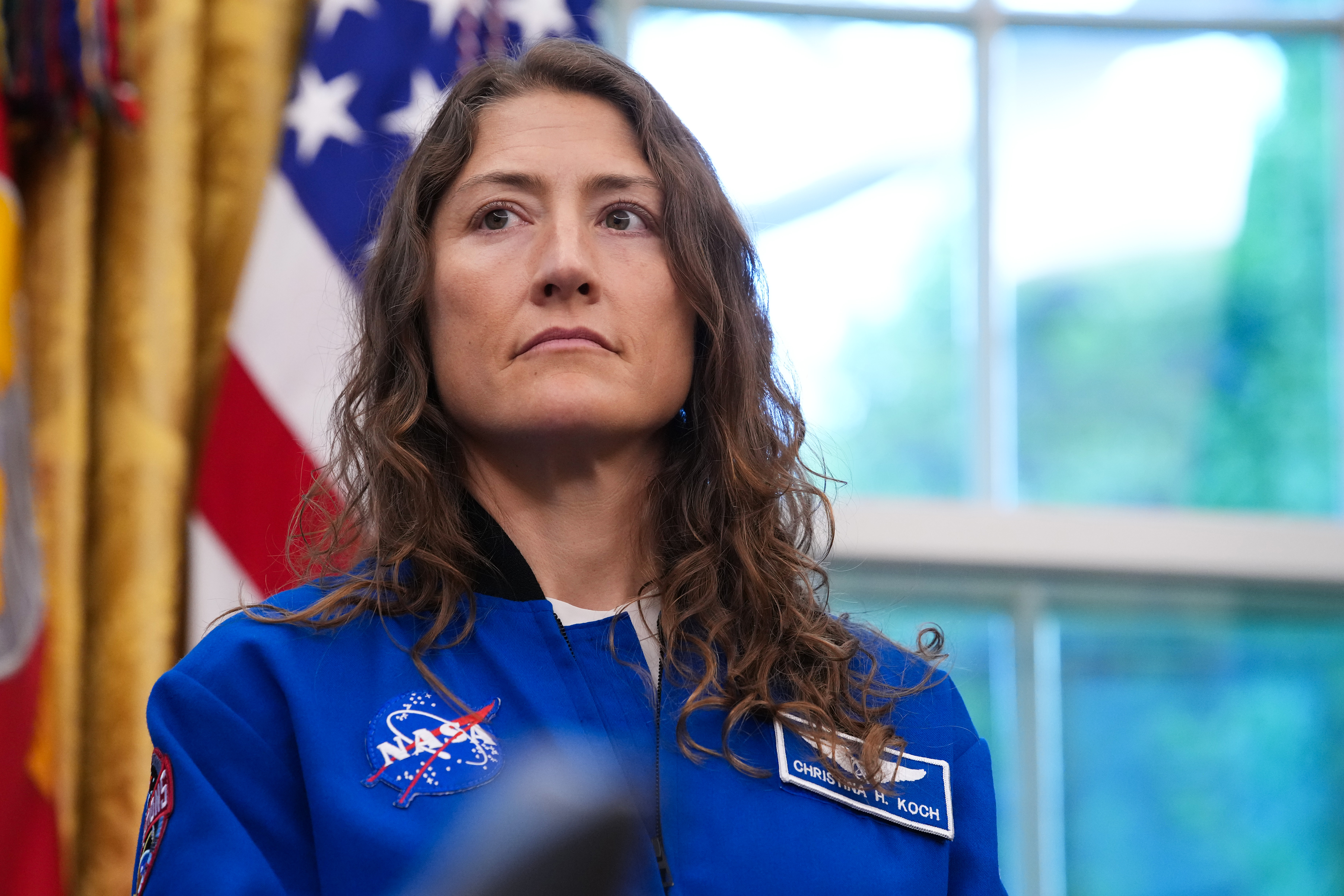 WASHINGTON, DC - APRIL 29: Artemis II astronaut, mission specialist Christina Koch attends an event with U.S. President Donald Trump in the Oval Office of the White House on April 29, 2026 in Washington, DC. The astronauts set a new record for the farthest any human has ever traveled into space aboard the Artemis II Space Launch System rocket and Orion spacecraft, orbiting around the moon and back while reaching 252,756 miles from Earth. (Photo by Andrew Harnik/Getty Images)