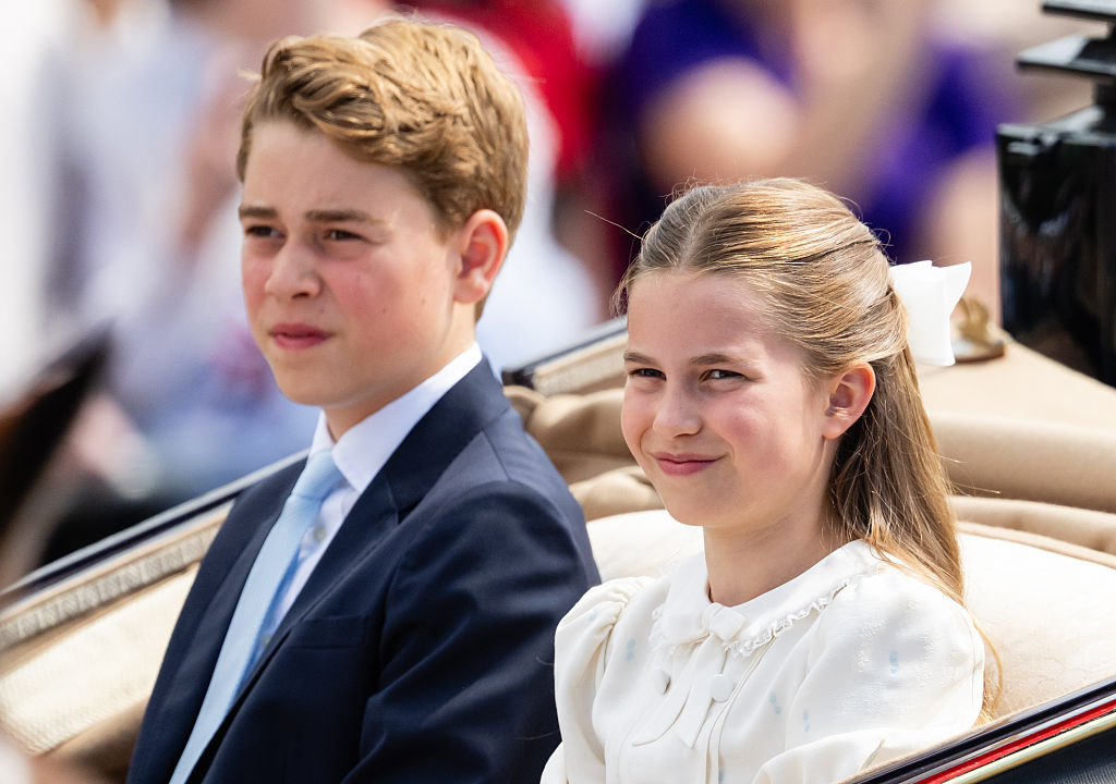 Prince George of Wales and Princess Charlotte of Wales travel by carriage during Trooping The Colour.