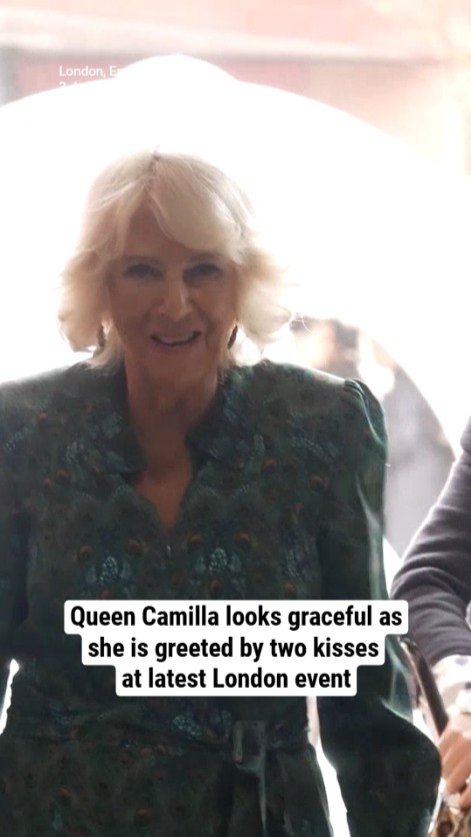Queen Camilla looks graceful as she is greeted by two kisses at latest London event