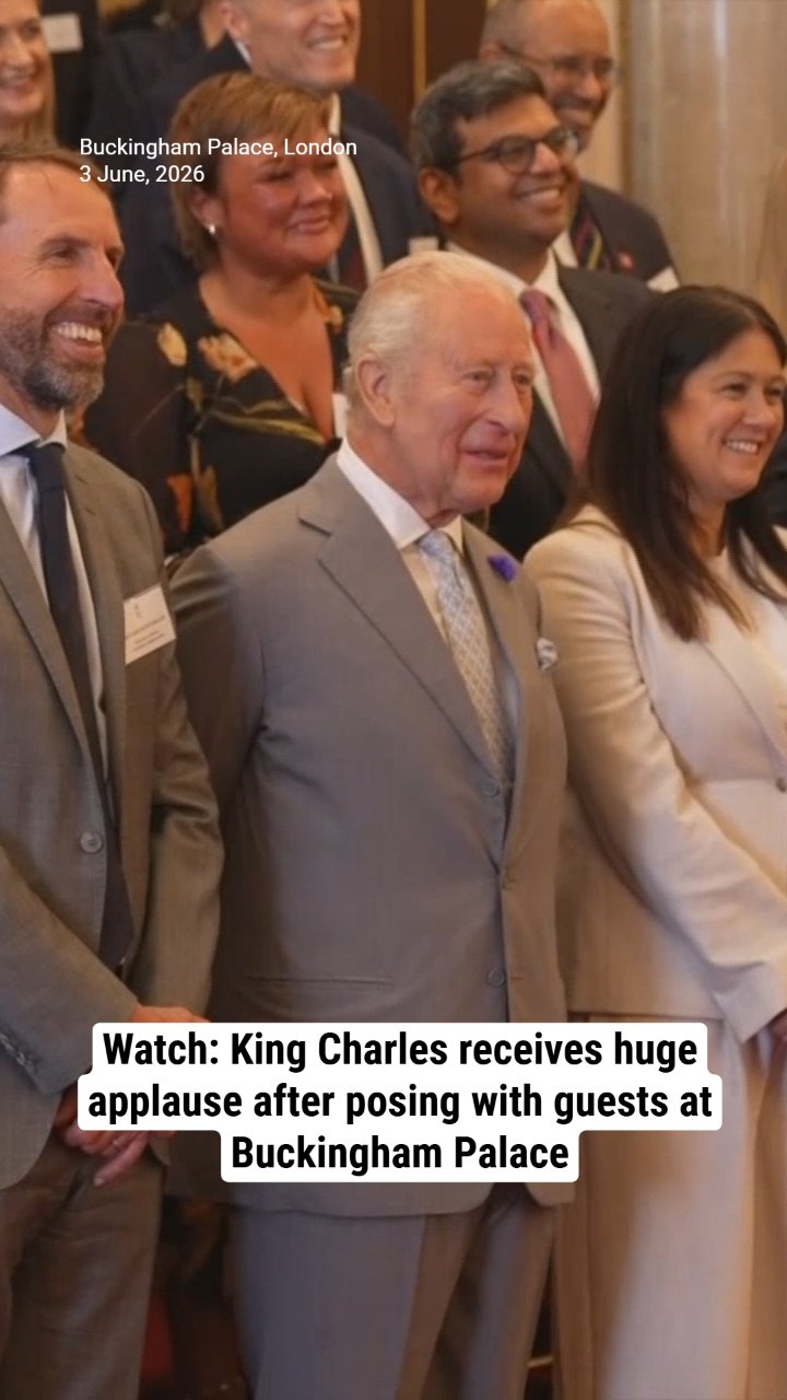 Watch: King Charles receives huge applause after posing with guests at Buckingham Palace