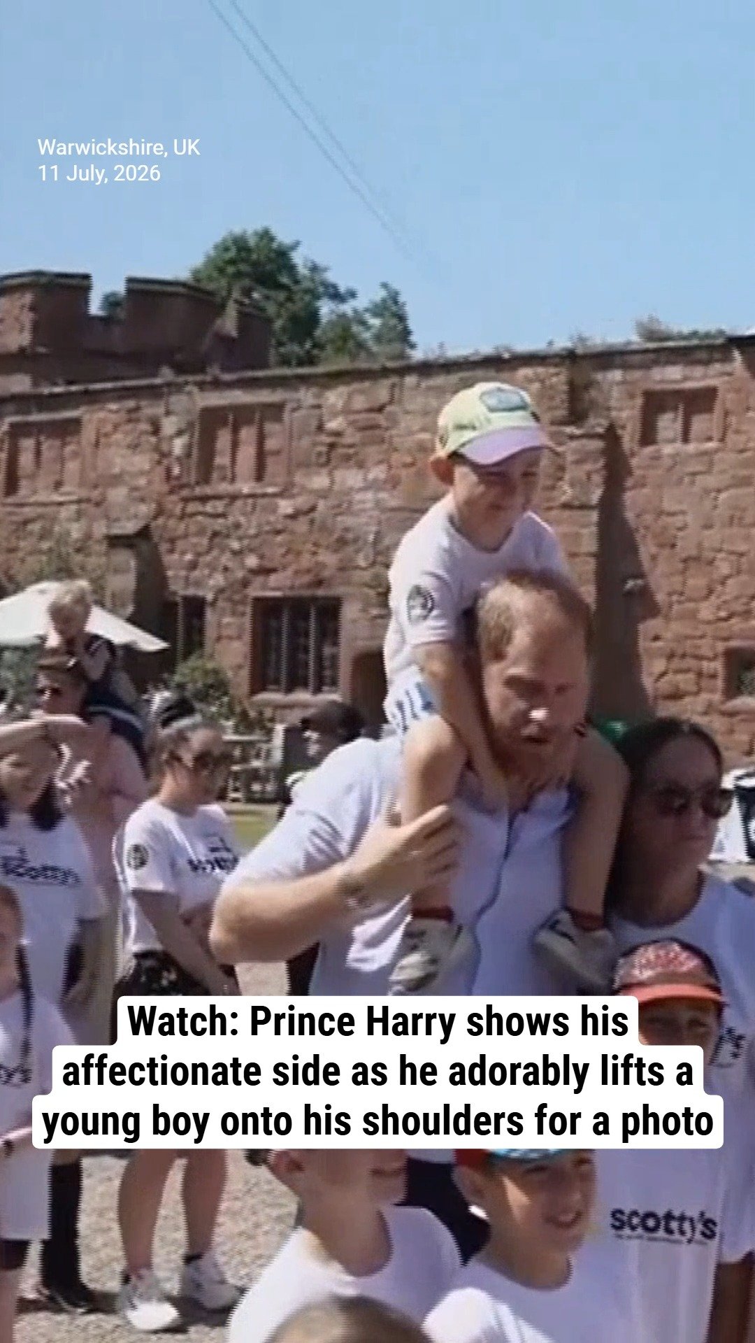 Watch: Prince Harry shows his affectionate side as he adorably lifts a young boy onto his shoulders for a photo