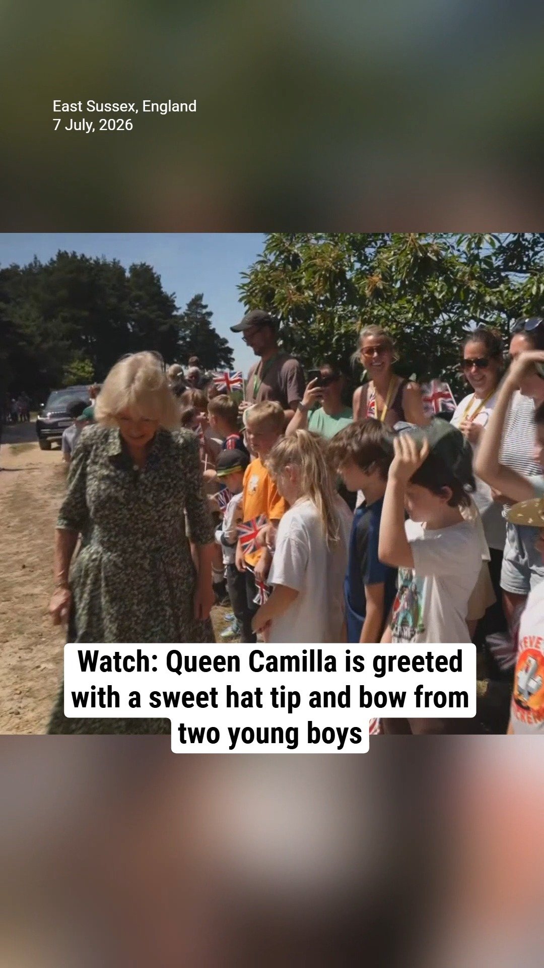 Watch: Queen Camilla is greeted with a sweet hat tip and bow from two young boys