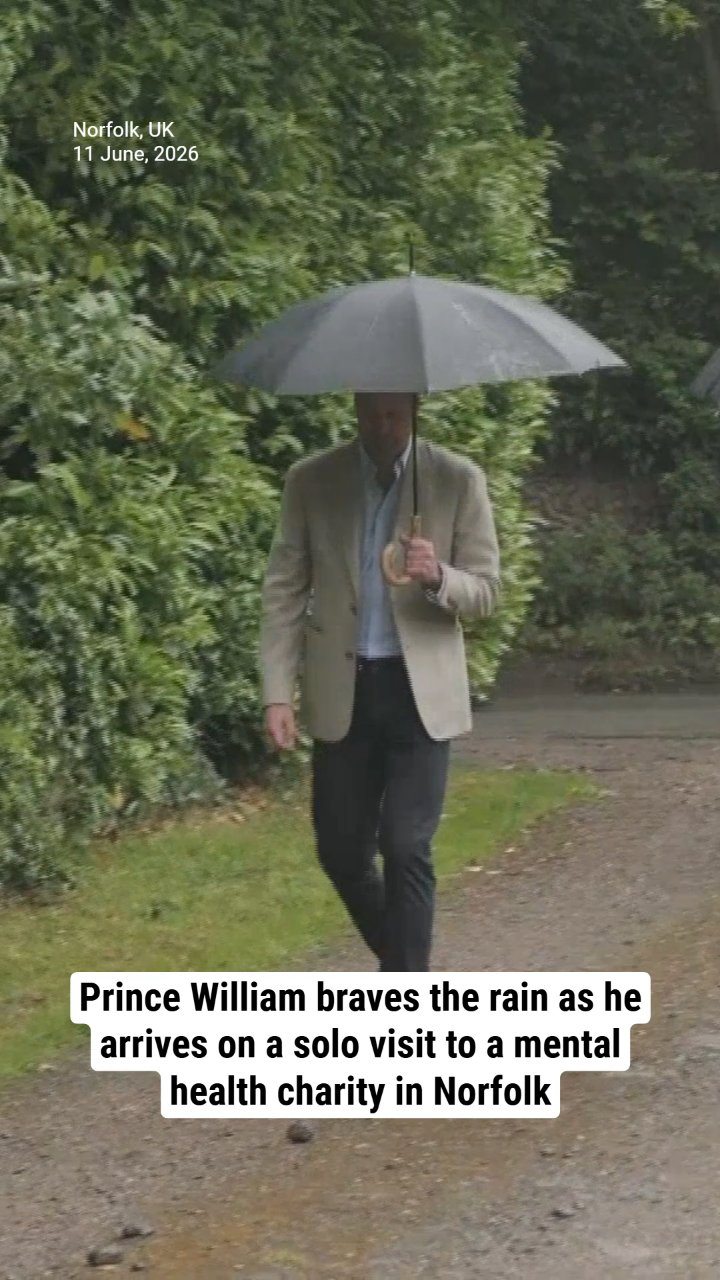 Prince William braves the rain as he arrives on a solo visit to a mental health charity in Norfolk