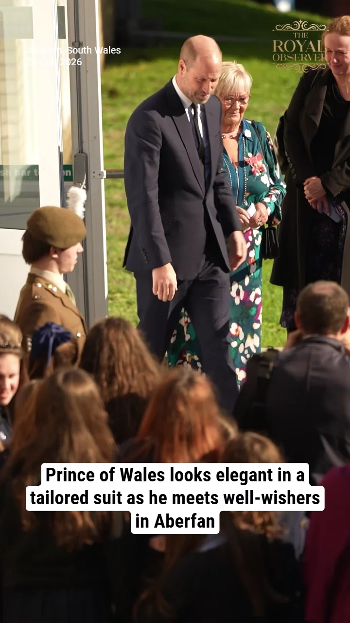 Prince of Wales looks elegant in a tailored suit as he meets well-wishers in Aberfan