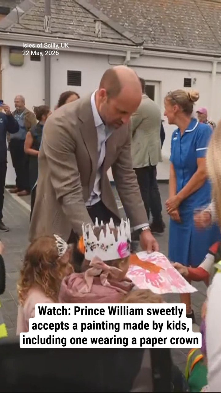 Watch: Prince William sweetly accepts a painting made by kids, including one wearing a paper crown