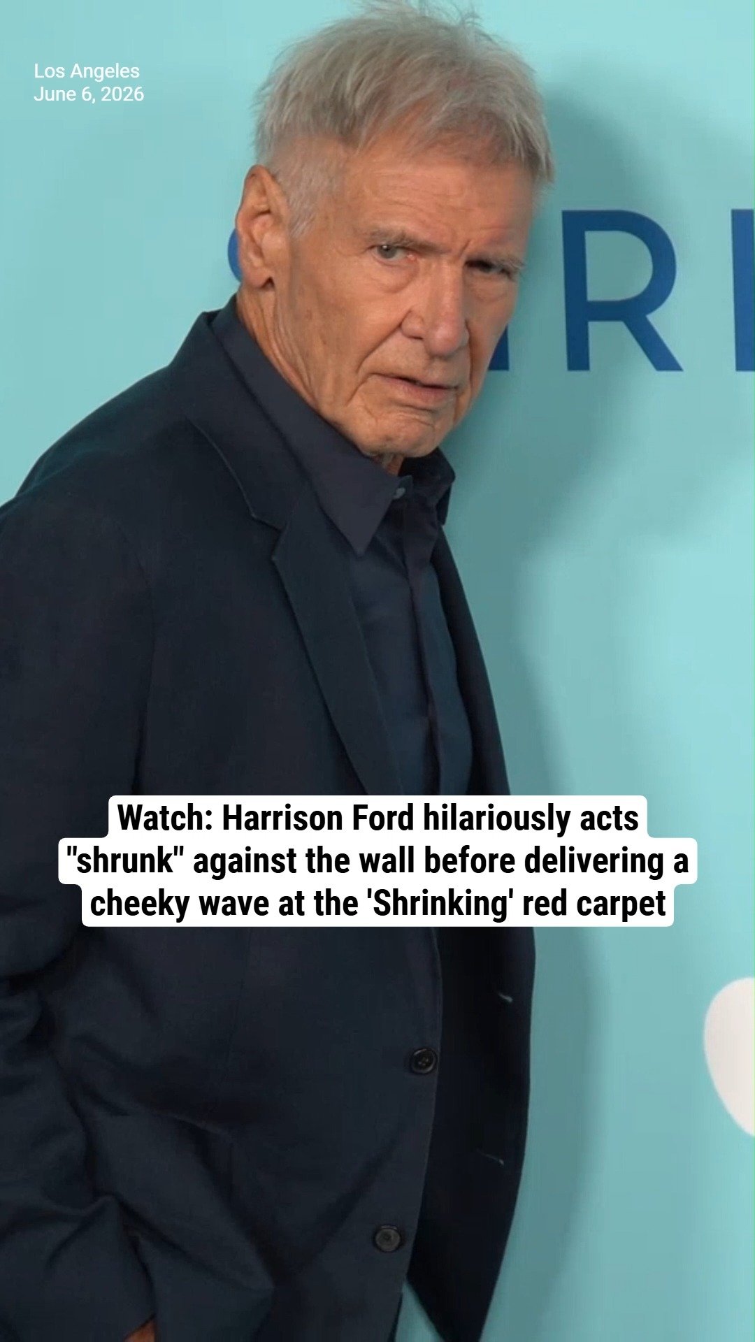 Watch: Harrison Ford hilariously acts "shrunk" against the wall before delivering a cheeky wave at the 'Shrinking' red carpet