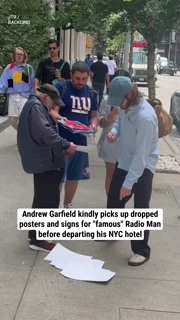 Andrew Garfield kindly picks up dropped posters and signs for "famous" Radio Man before departing his NYC hotel