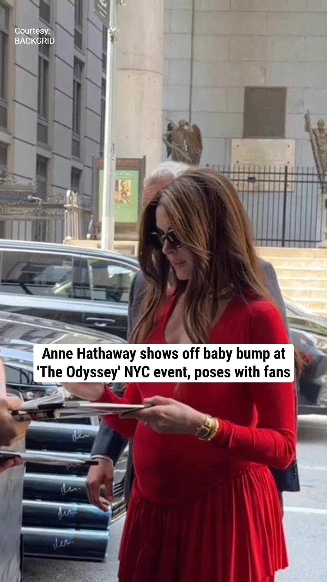 Anne Hathaway shows off baby bump at 'The Odyssey' NYC event, poses with fans