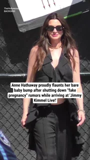Anne Hathaway proudly flaunts her bare baby bump after shutting down "fake pregnancy" rumors while arriving at 'Jimmy Kimmel Live!'