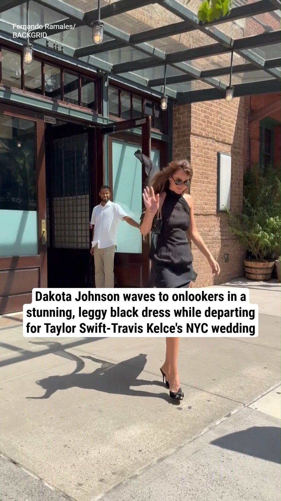 Dakota Johnson waves to onlookers in a stunning, leggy black dress while departing for Taylor Swift-Travis Kelce's NYC wedding