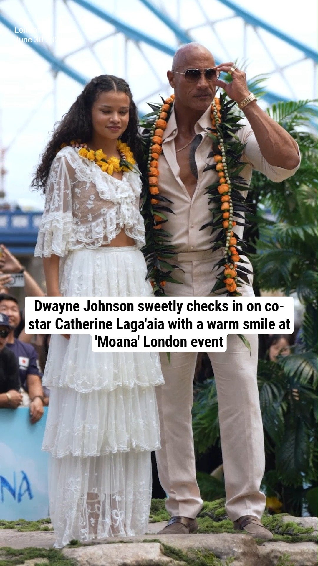 Dwayne Johnson sweetly checks in on co-star Catherine Laga'aia with a warm smile at 'Moana' London event