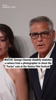 WATCH: George Clooney cheekily snatches a camera from a photographer to shoot the "Furies" cast at the Venice Film Festival