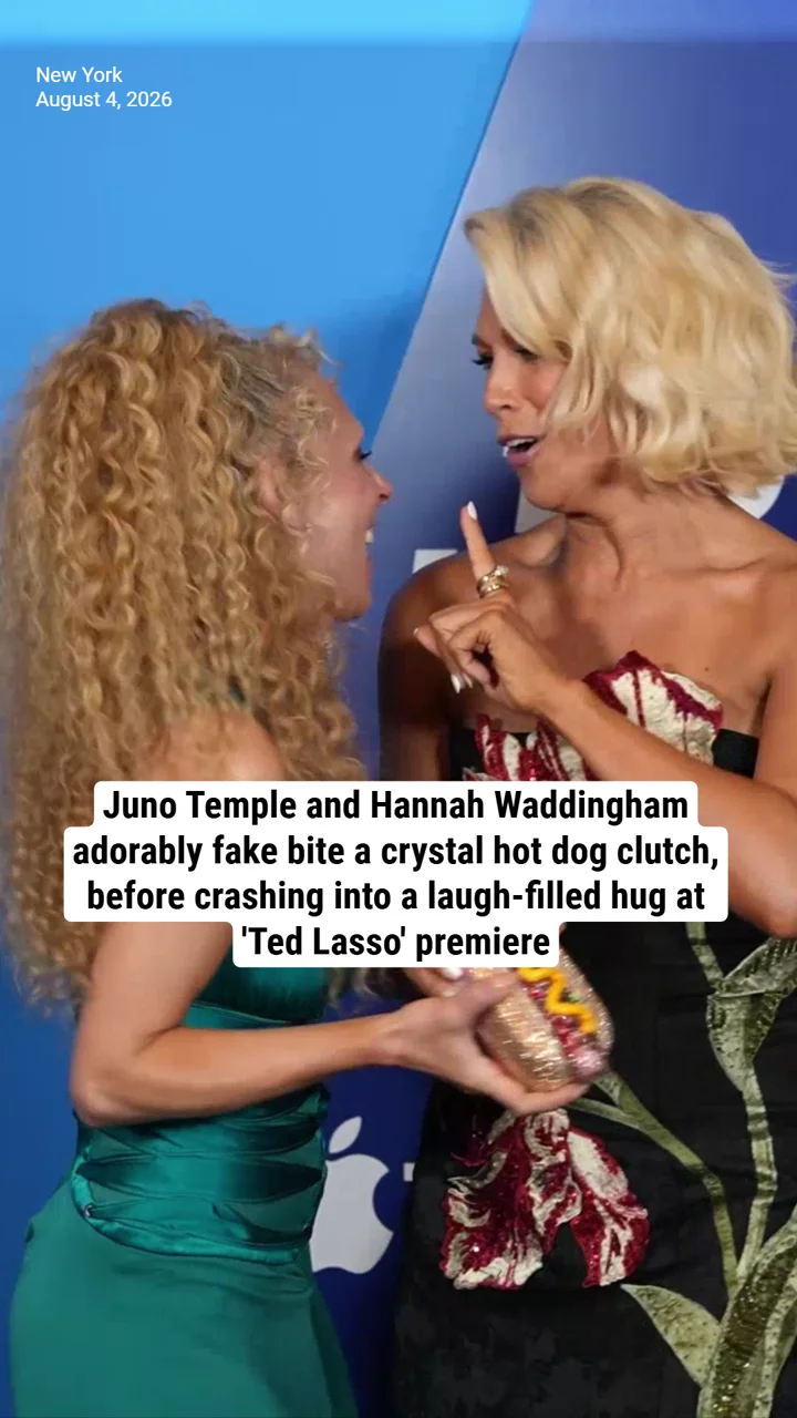 Juno Temple and Hannah Waddingham adorably fake bite a crystal hot dog clutch, before crashing into a laugh-filled hug at 'Ted Lasso' premiere