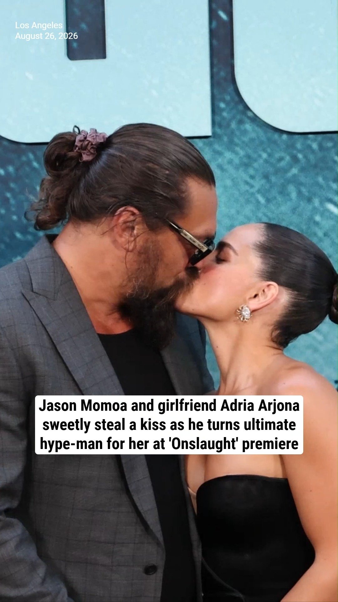 Jason Momoa and girlfriend Adria Arjona sweetly steal a kiss as he turns ultimate hype-man for her at 'Onslaught' premiere