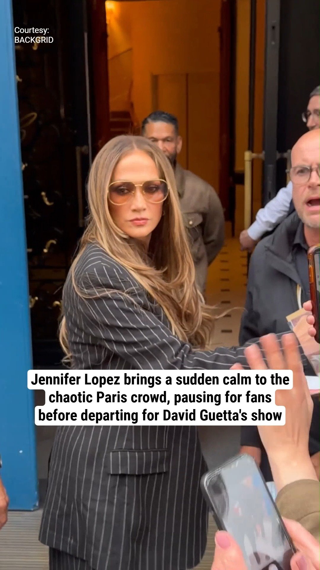 Jennifer Lopez brings a sudden calm to the chaotic Paris crowd, pausing for fans before departing for David Guetta's show