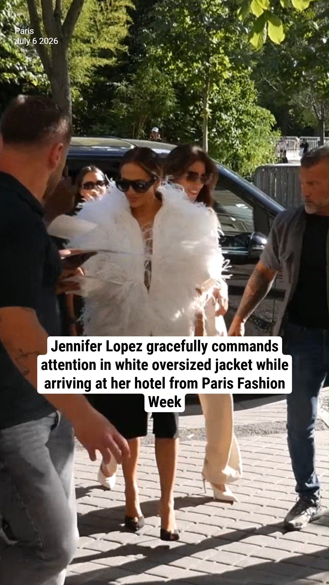 Jennifer Lopez gracefully commands attention in white oversized jacket while arriving at her hotel from Paris Fashion Week