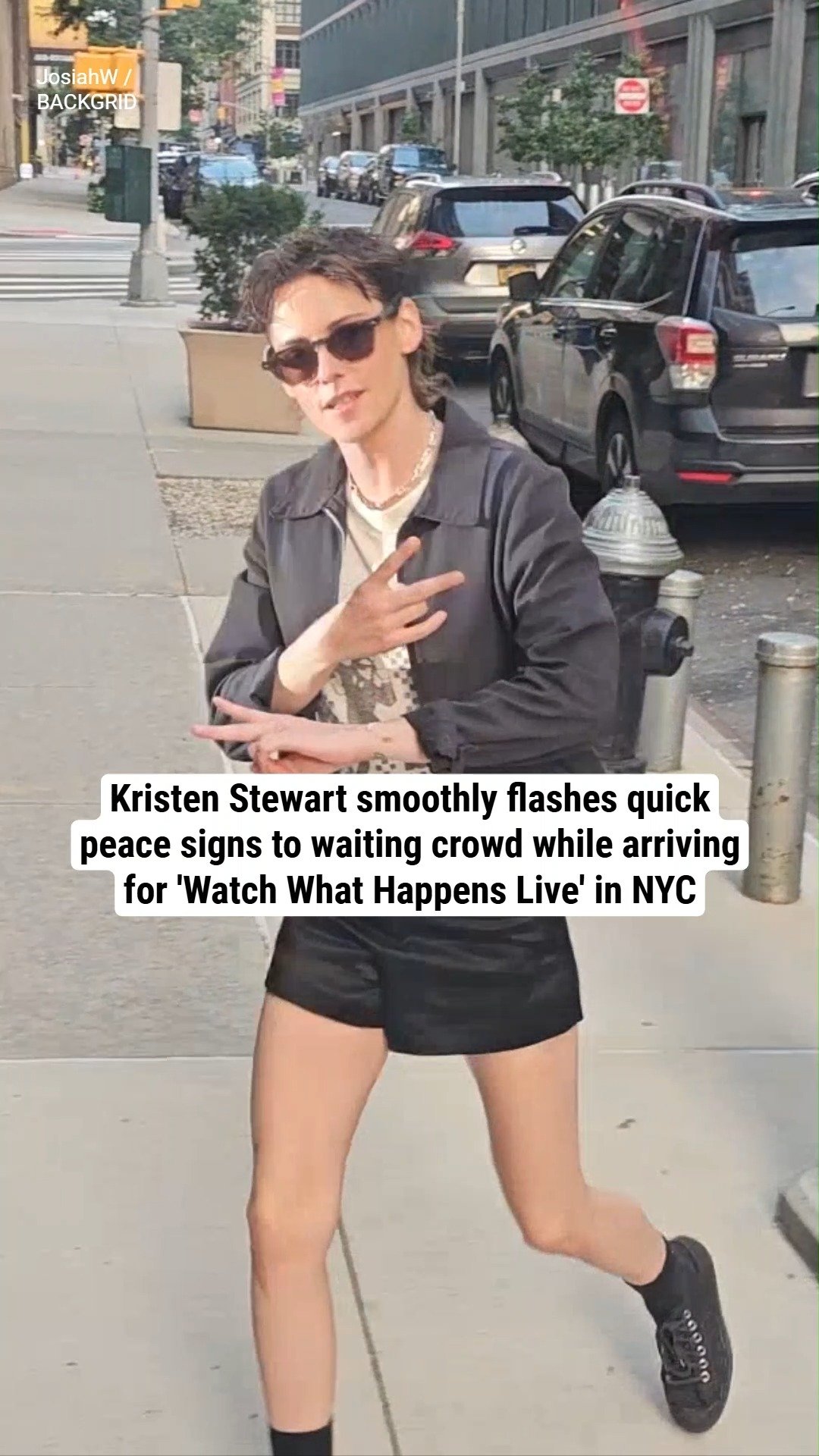 Kristen Stewart smoothly flashes quick peace signs to waiting crowd while arriving for 'Watch What Happens Live' in NYC
