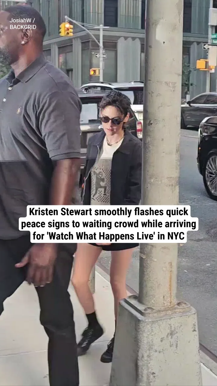 Kristen Stewart smoothly flashes quick peace signs to waiting crowd while arriving for 'Watch What Happens Live' in NYC