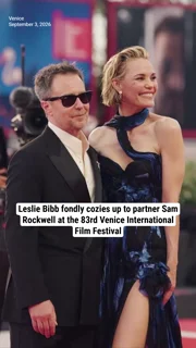 Leslie Bibb fondly cozies up to partner Sam Rockwell at the 83rd Venice International Film Festival