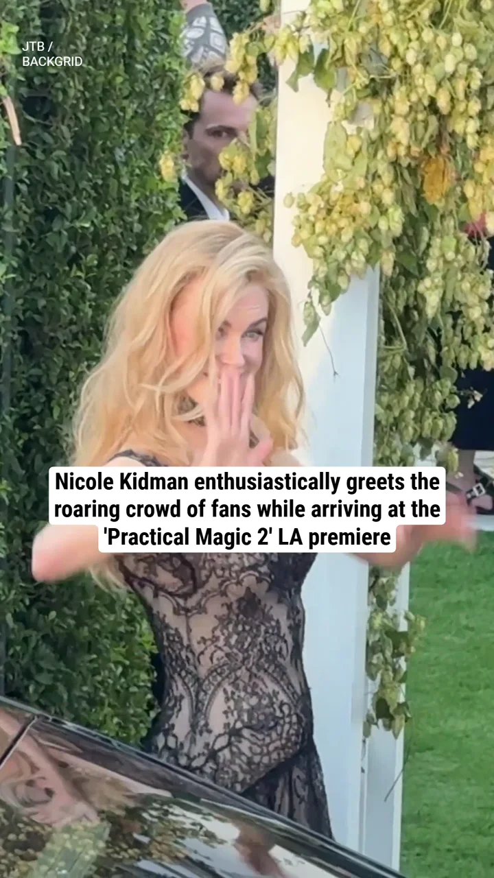 Nicole Kidman enthusiastically greets the roaring crowd of fans while arriving at the 'Practical Magic 2' LA premiere