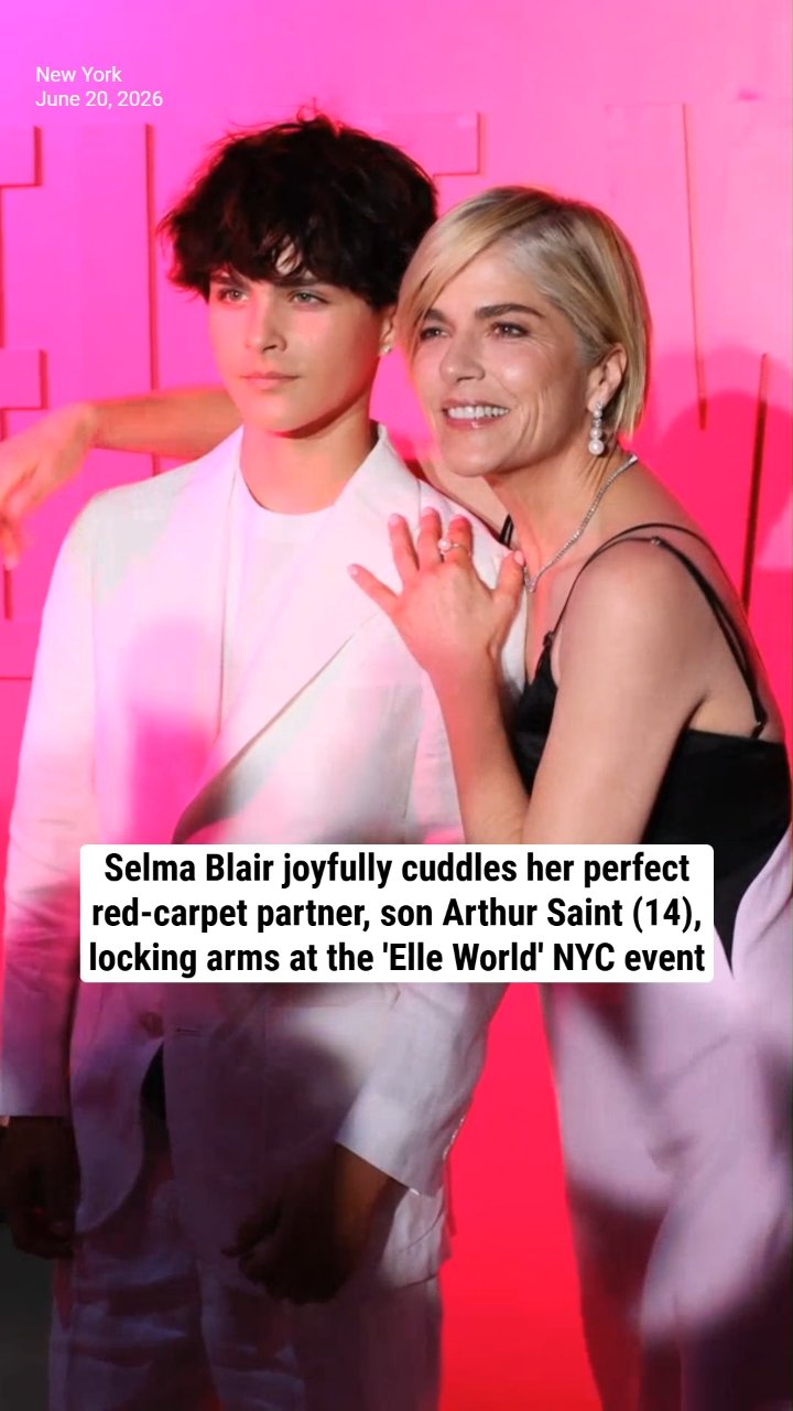 Selma Blair joyfully cuddles her perfect red-carpet partner, son Arthur Saint (14), locking arms at the 'Elle World' NYC event