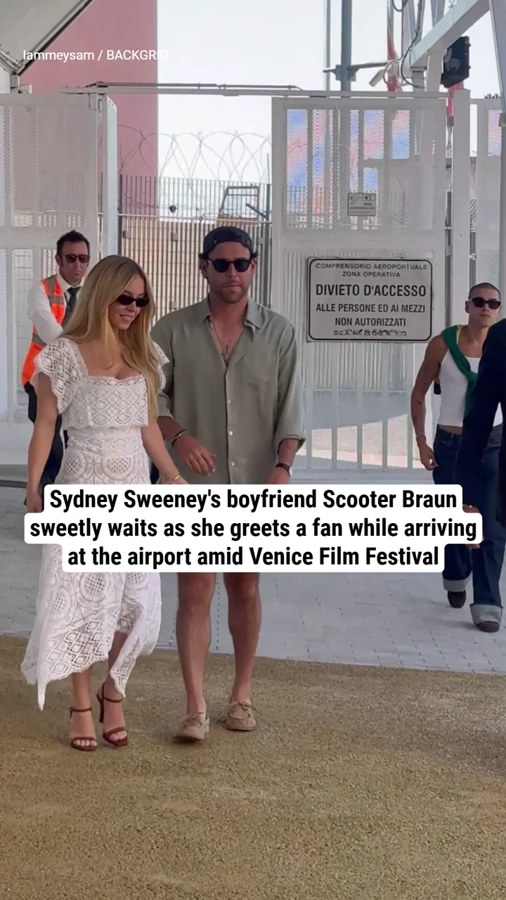 Sydney Sweeney's boyfriend Scooter Braun sweetly waits as she greets a fan while arriving at the airport amid Venice Film Festival