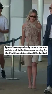 Sydney Sweeney radiantly spreads her arms wide to soak in the Venice sun, arriving for the 83rd Venice International Film Festival