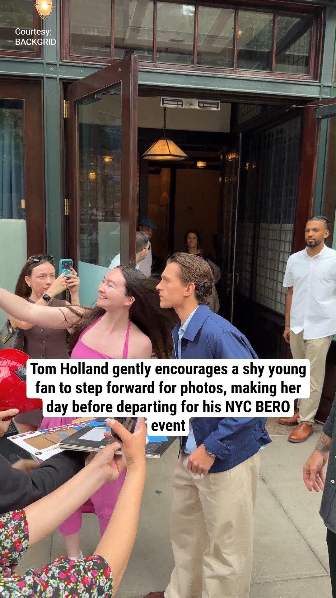 Tom Holland gently encourages a shy young fan to step forward for photos, making her day before departing for his NYC BERO event