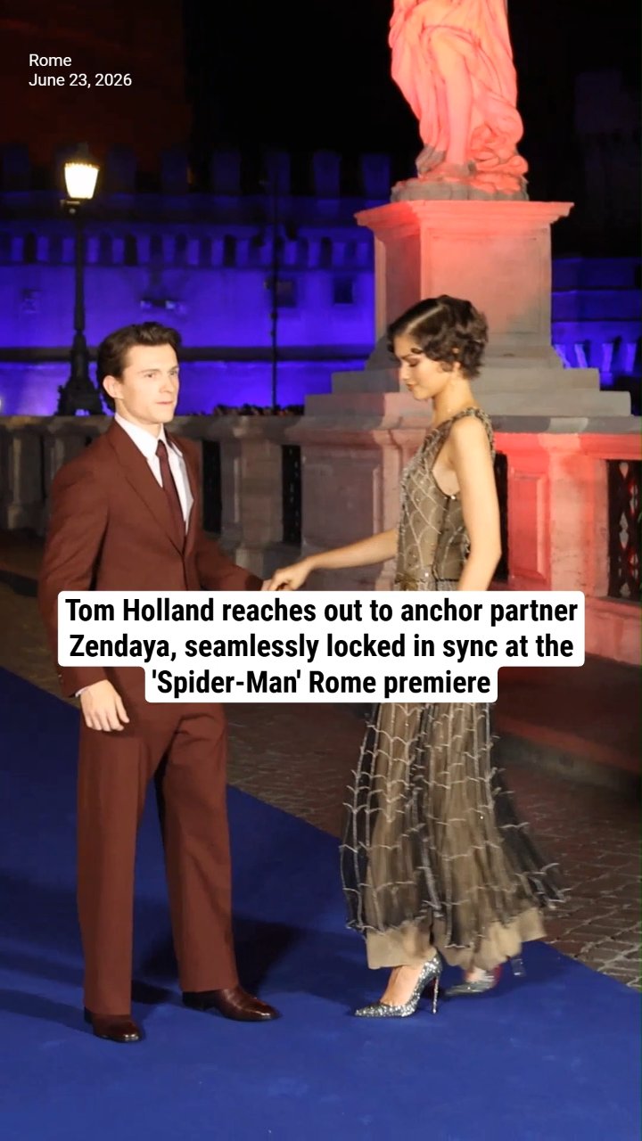 Tom Holland reaches out to anchor partner Zendaya, seamlessly locked in sync at the 'Spider-Man' Rome premiere