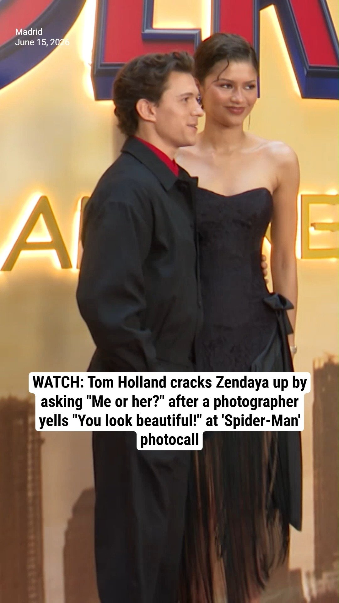 WATCH: Tom Holland cracks Zendaya up by asking "Me or her?" after a photographer yells "You look beautiful!" at 'Spider-Man' photocall