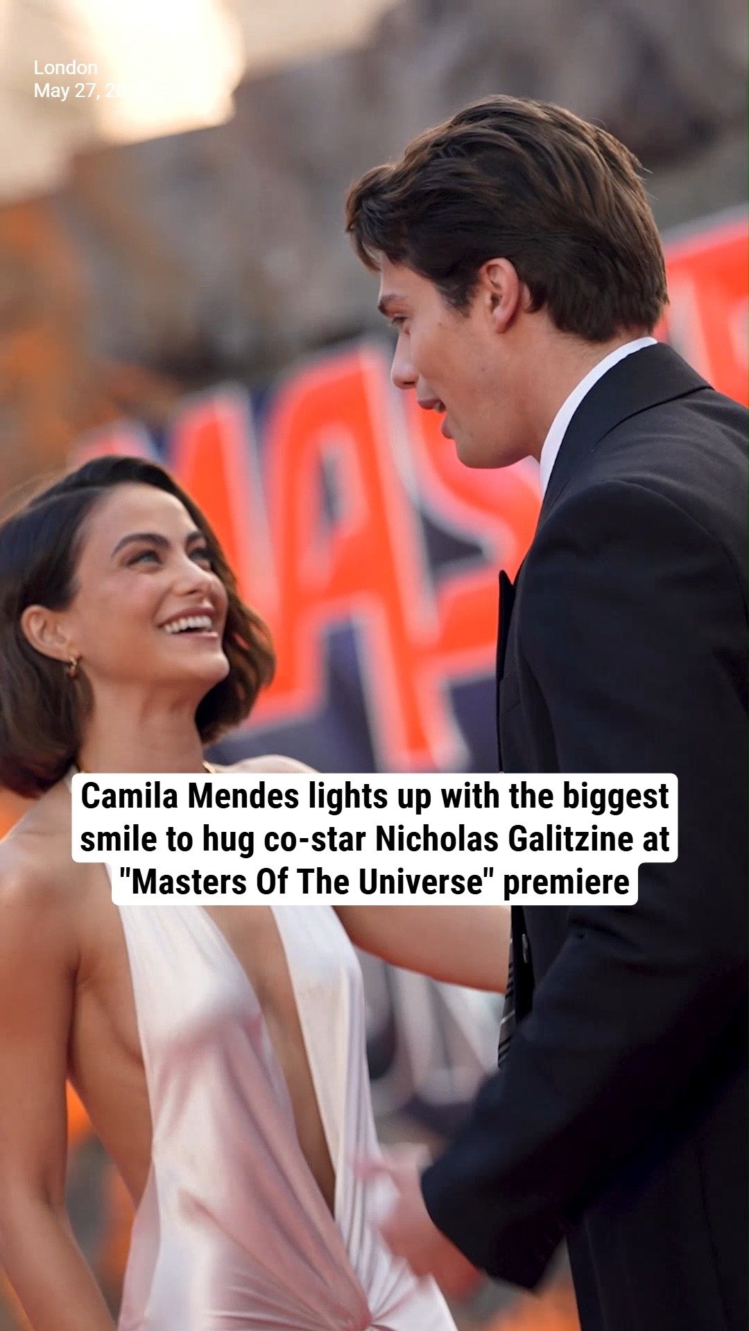 Camila Mendes lights up with the biggest smile to hug co-star Nicholas Galitzine at "Masters Of The Universe" premiere