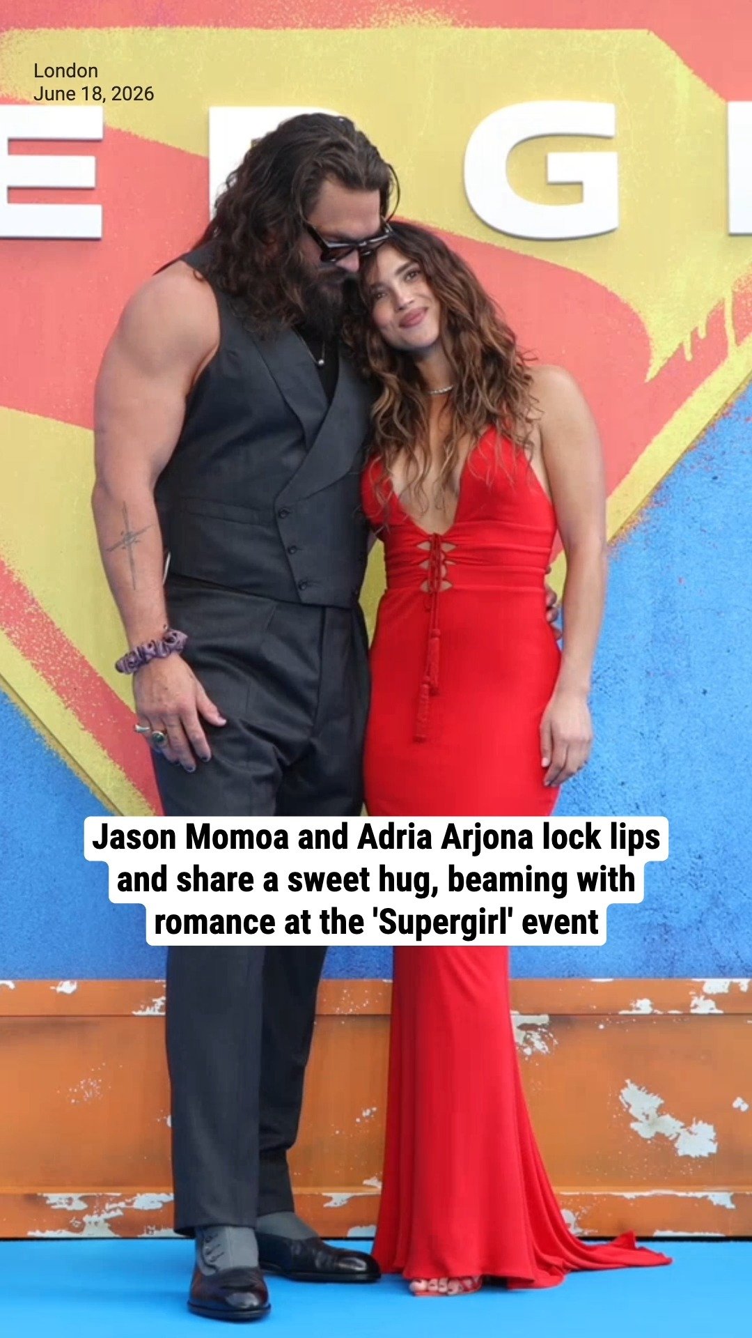 Jason Momoa and Adria Arjona lock lips and share a sweet hug, beaming with romance at the 'Supergirl' event