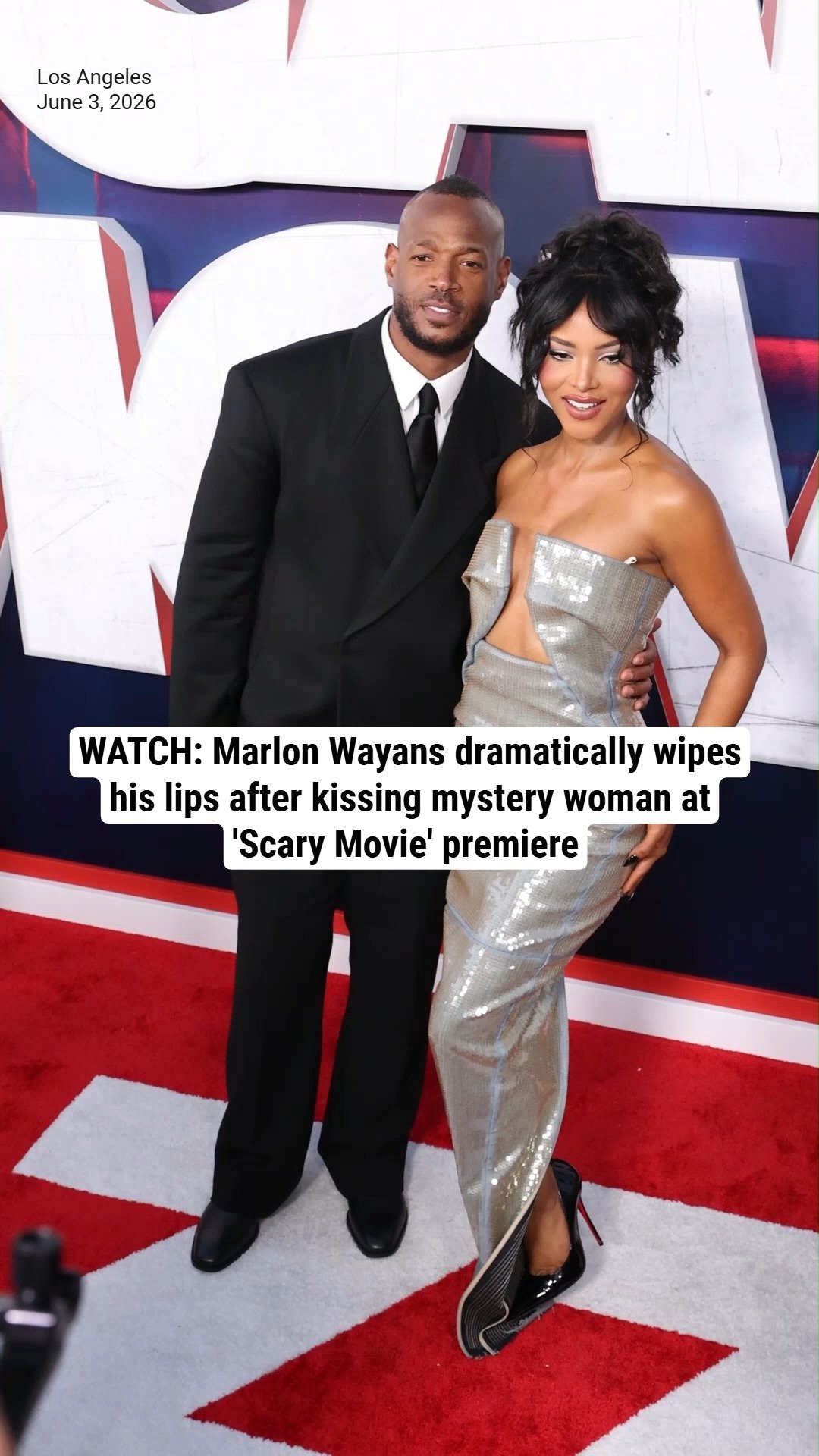 WATCH: Marlon Wayans dramatically wipes his lips after kissing mystery woman at 'Scary Movie' premiere