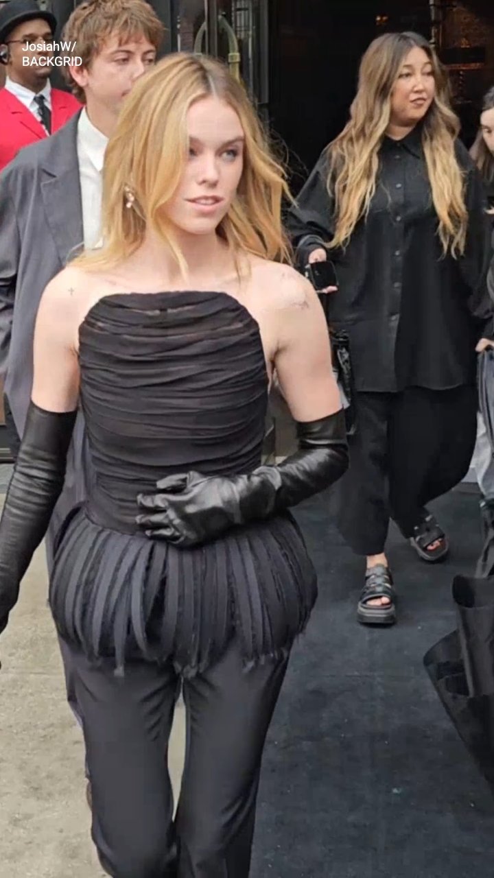Milly Alcock departs for the 'Supergirl' premiere in New York, looking elegantly edgy in dramatic black opera gloves