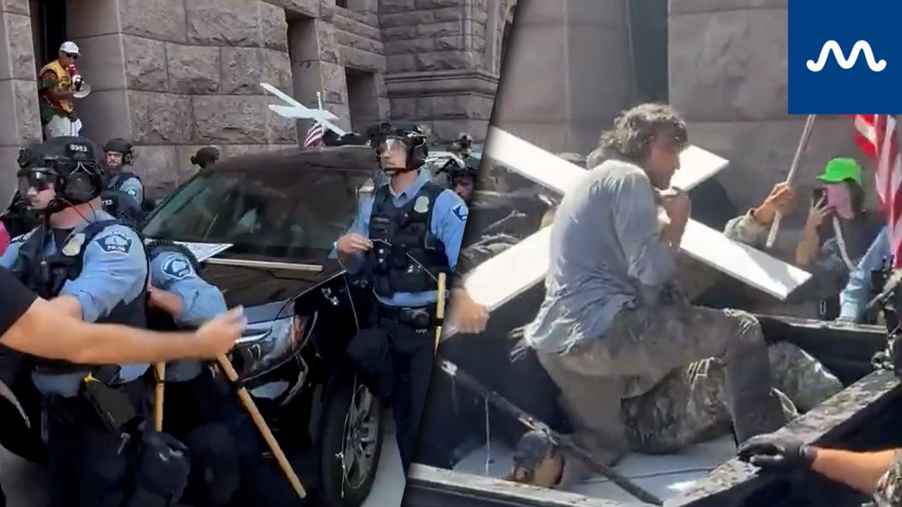 Jake Lang Escorted by Minneapolis Police as Supporters’ Vehicles Push Through Protest Crowd